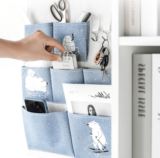 Bolsa de almacenamiento para colgar en la pared con bolsillos